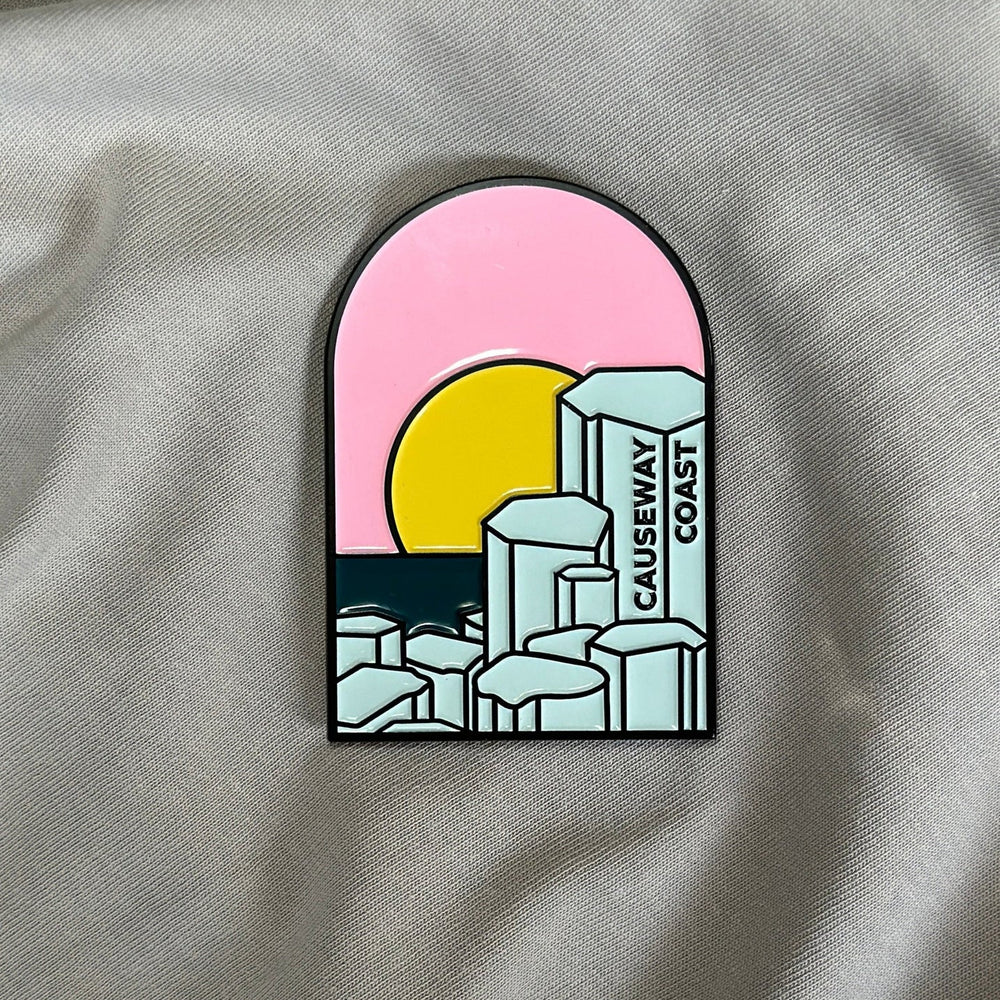 Causeway Coast Pin on a fabric background